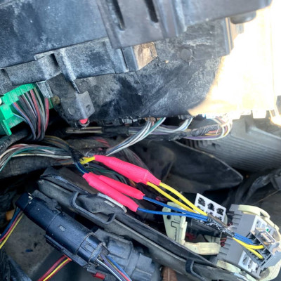 Image of the components under a car hood, for wire repair