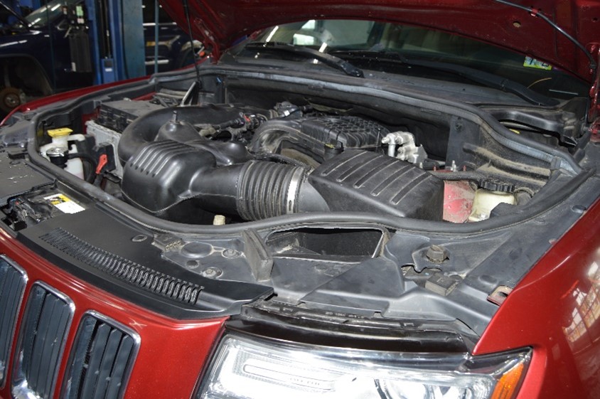 Under the hood image, indicating front-end repair work.