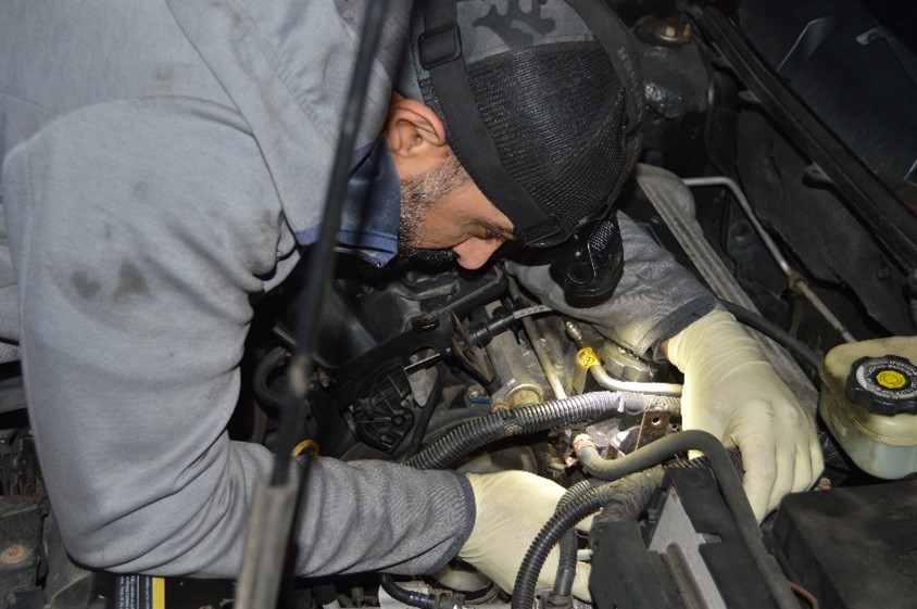 Image of an Auto Masters Goodyear technician at work completing a vehicle inspection.